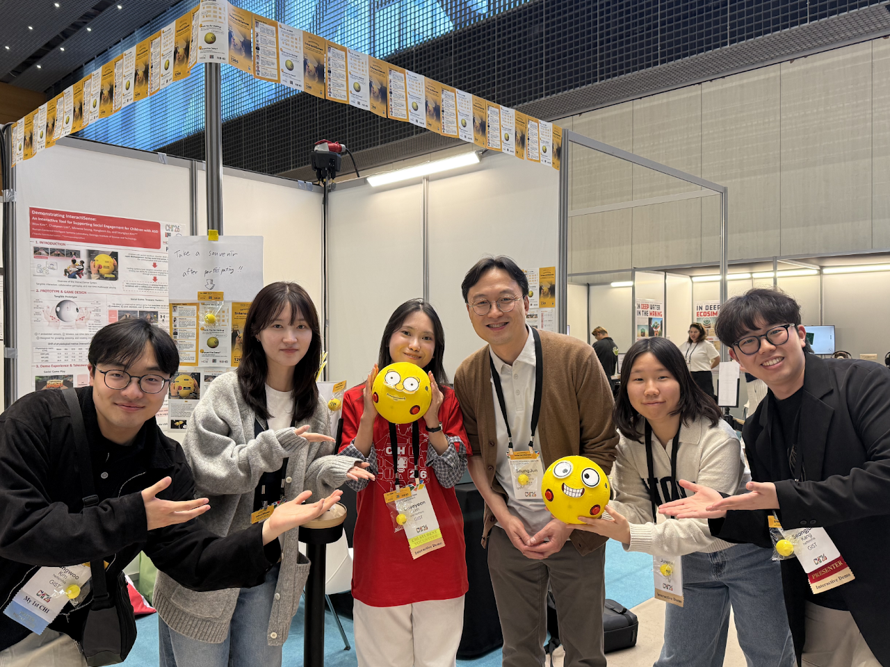 Group photo at an interactive demonstration booth at CHI 2026.