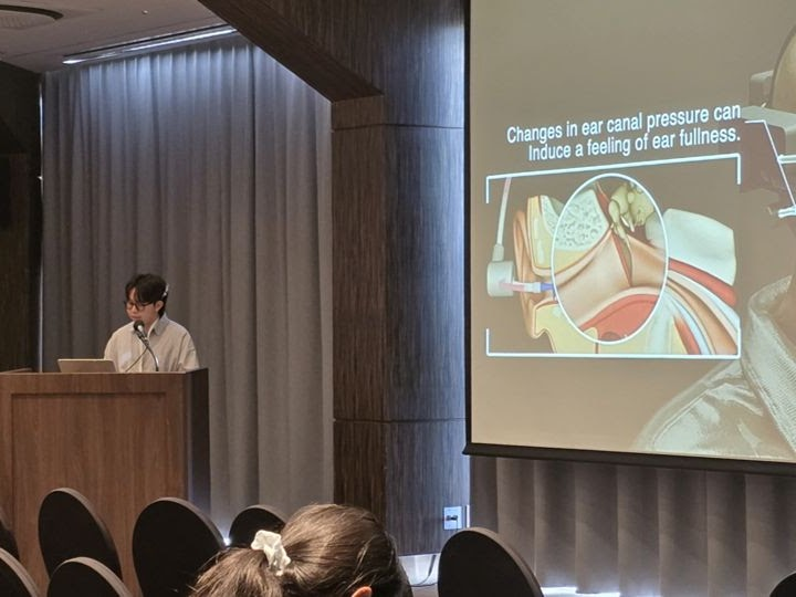 Conference presentation about ear canal pressure at UIST 2025.